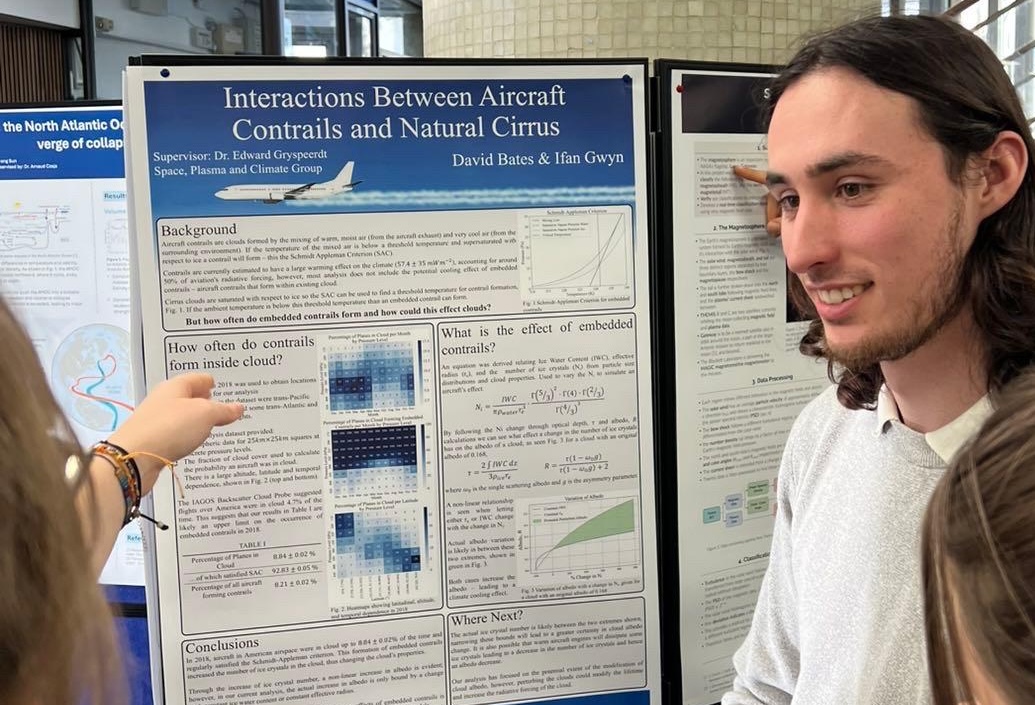 David Bates presenting a Master's thesis poster on climate and emissions data analysis
